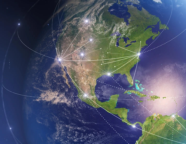 Earth seen from space with lines connecting different locations worldwide, illustrating global connectivity through free internet available in nearly 200 countries, provided by Vasco Translators.
